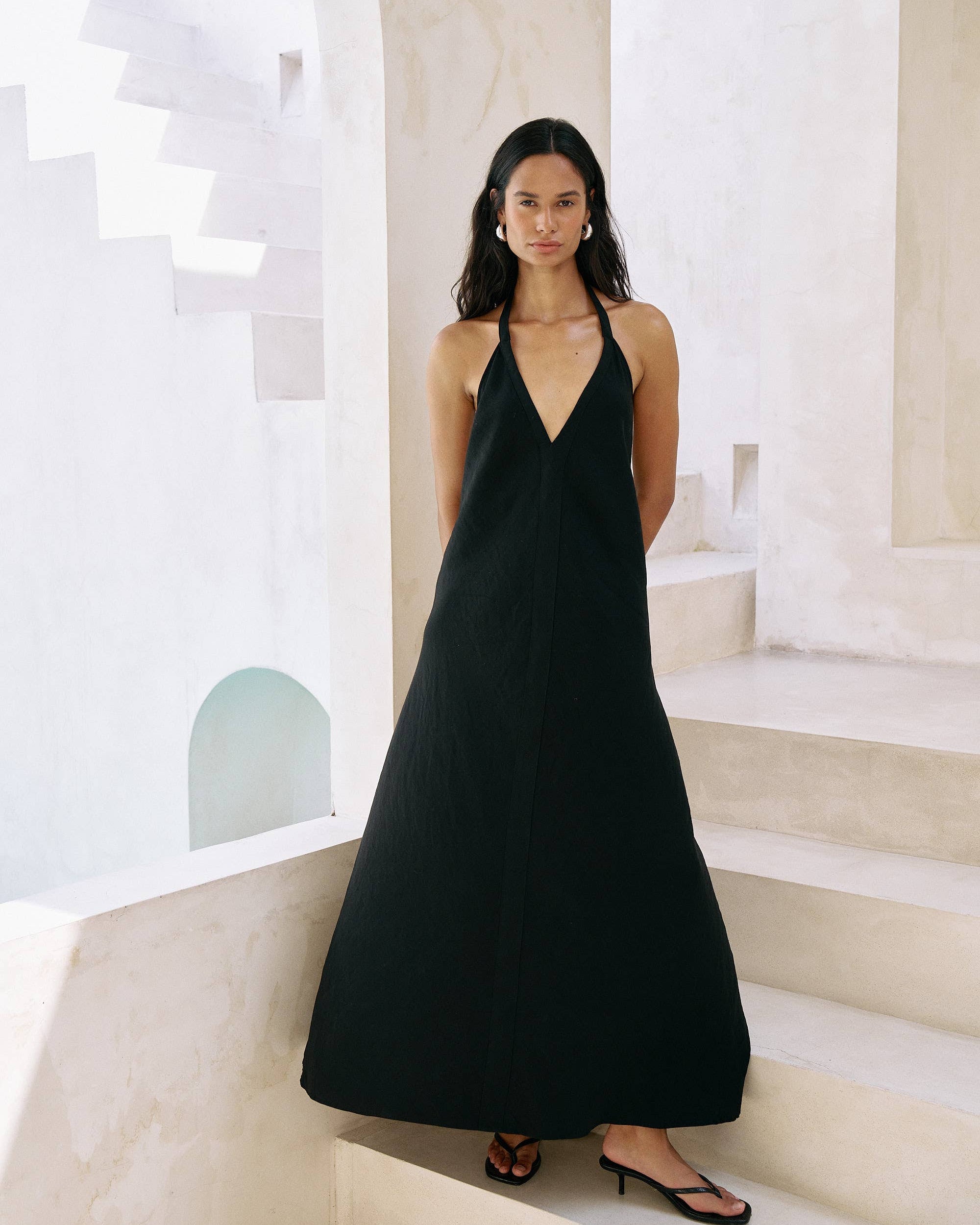 Zoe Maxi Dress: sleeveless black dress with square neckline, fitted bodice, flowing ankle-length hem
