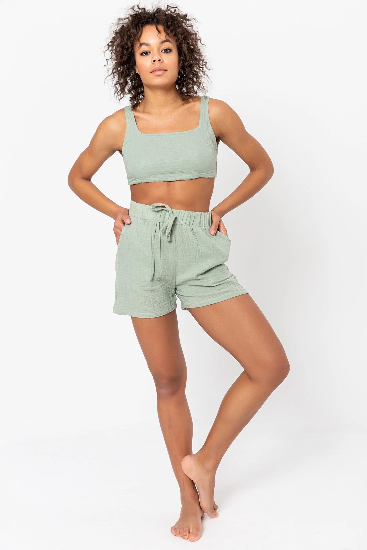 Basic Shorts: high-rise beige shorts with straight leg, mid-thigh length, and clean hem