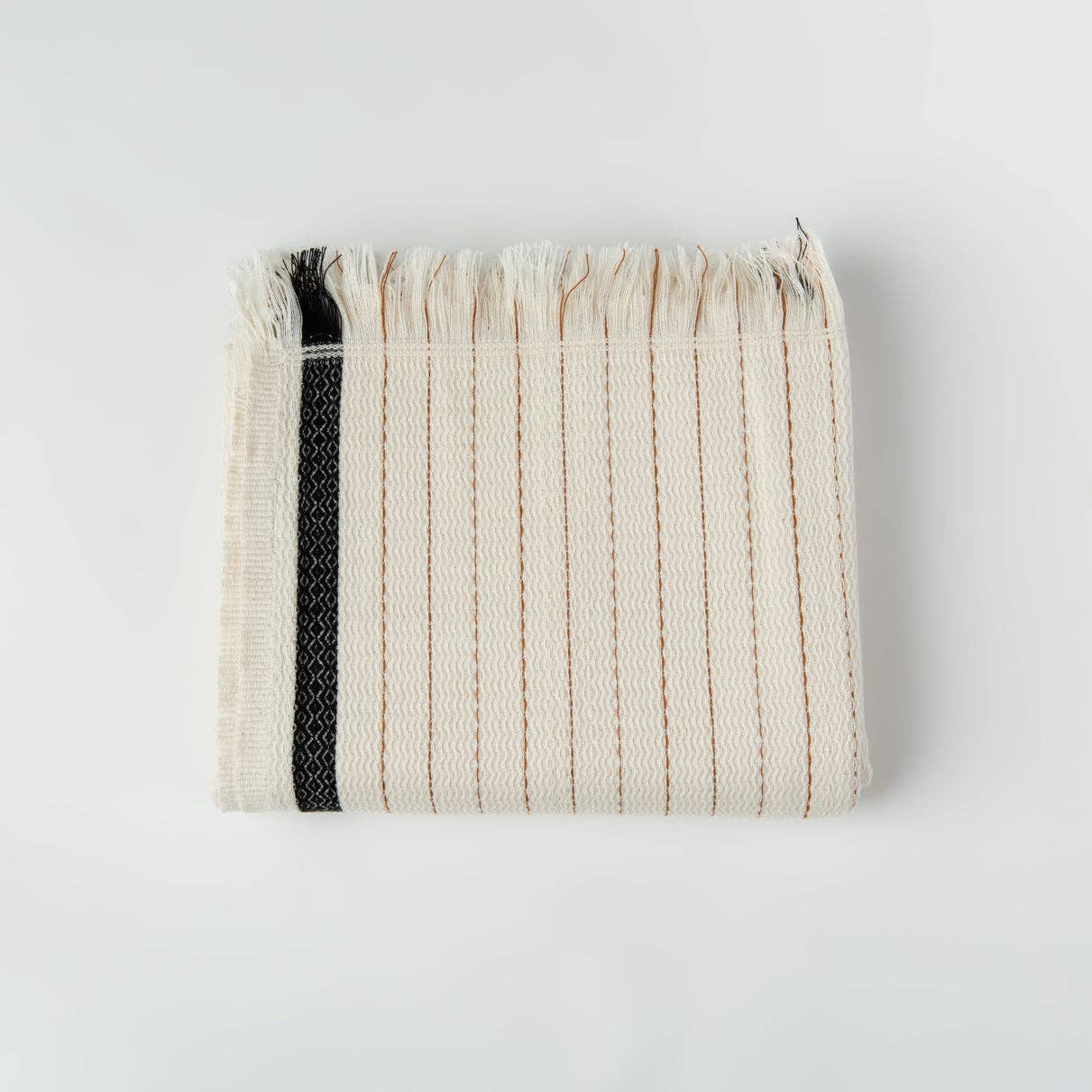 Silvia 100% Cotton Turkish Bath Towel: rectangular, ivory with subtle woven texture and fringed edges