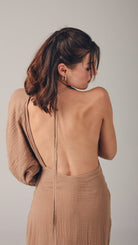 Sofia Dress: sleeveless, cream-colored midi dress with square neckline and straight hem