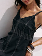 Eva Maxi Dress: sleeveless beige dress with scoop neckline, fitted bodice, and flowing midi skirt