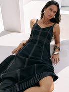 Eva Maxi Dress: sleeveless white maxi dress with straight neckline and flowing skirt hem