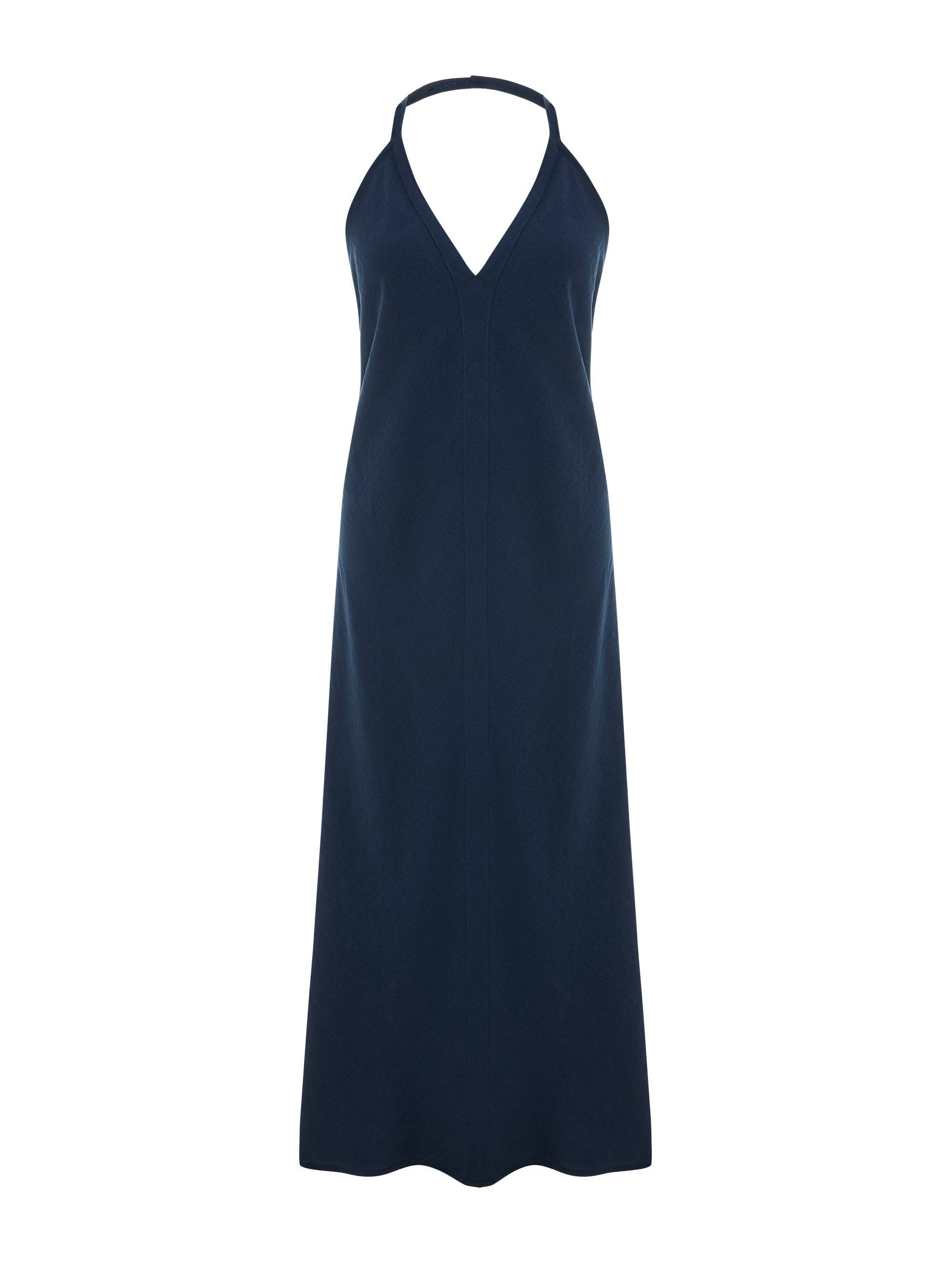 Navy halter maxi dress flat lay, deep V-neckline, center front seam, A-line silhouette, open back with single neck strap, slub-textured fabric, floor-length hem
