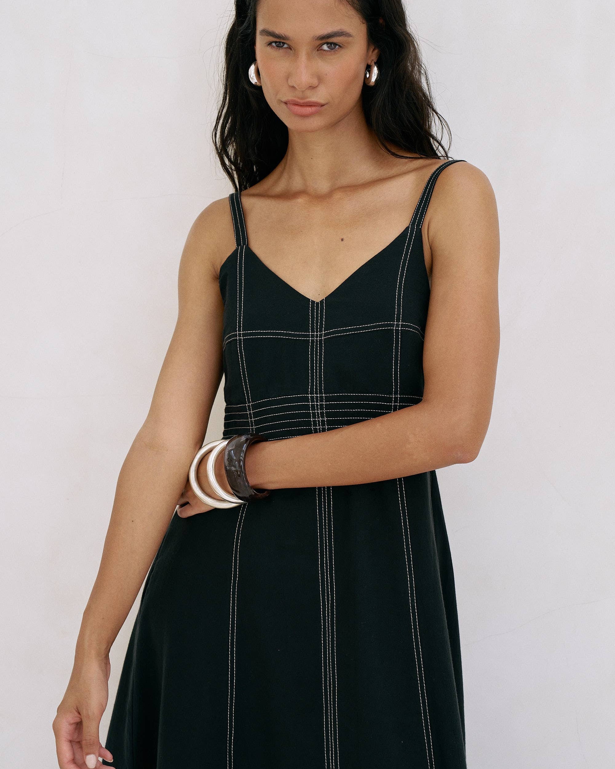 Eva Maxi Dress: sleeveless ivory maxi dress with deep V-neckline and gathered waist