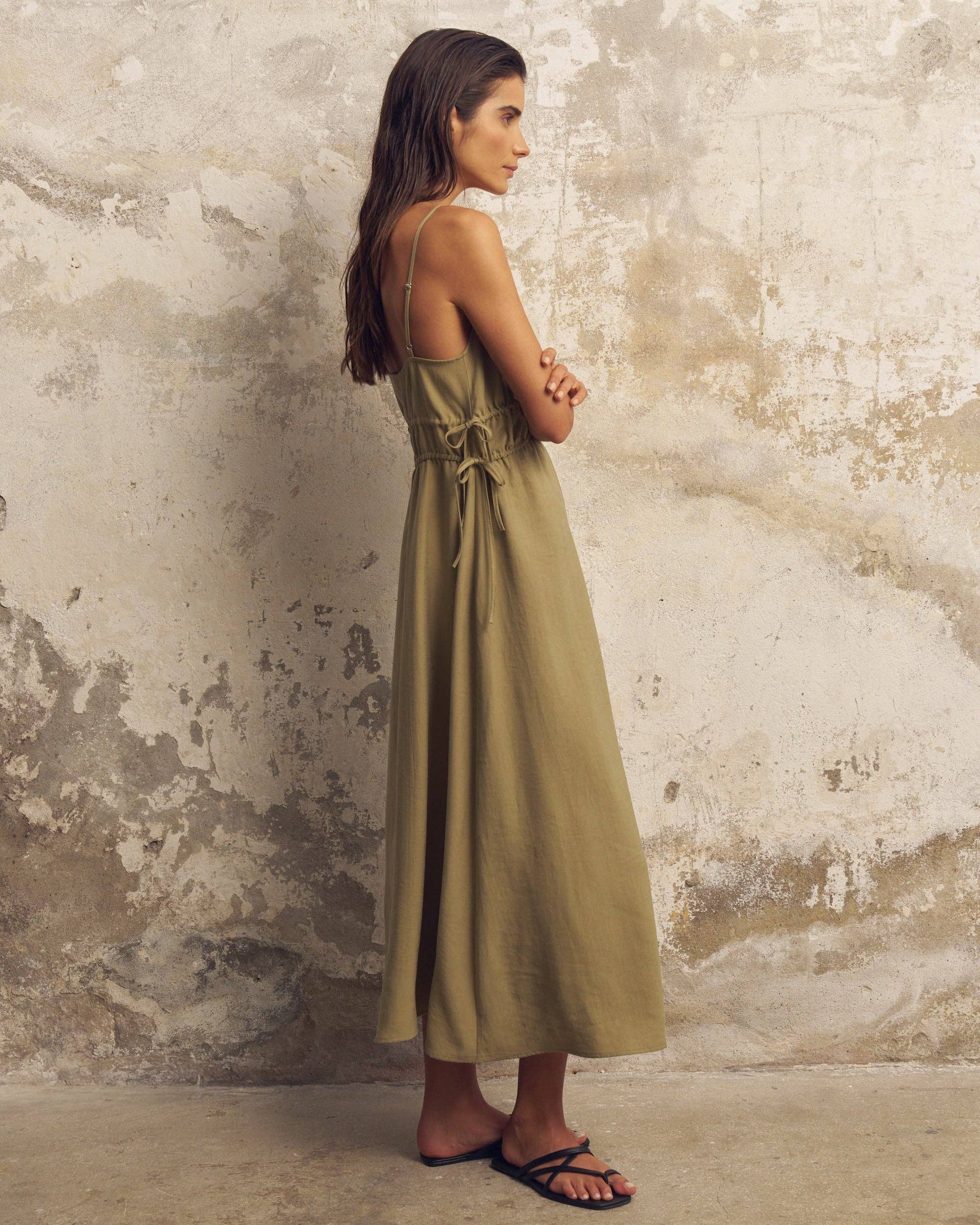 Sofia Ties Maxi Dress: sleeveless, brown with white tie waist, deep V-neck, flowing ankle-length hem