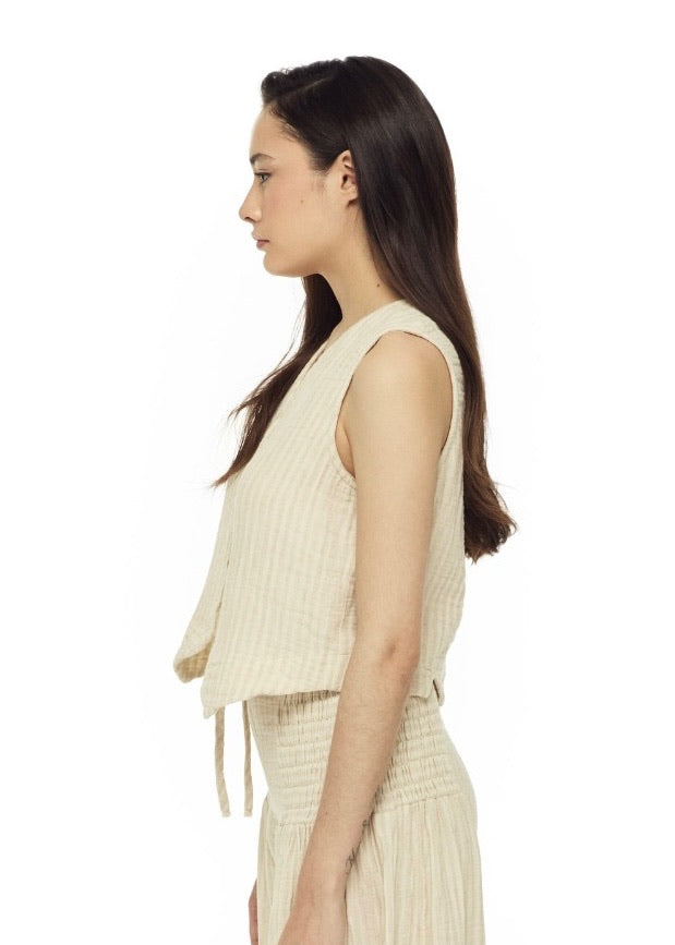 Striped Vest: sleeveless blouse with vertical black and white stripes, straight hem, round neckline