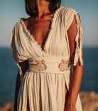 Shahmaran Dress: sleeveless, straight fit midi dress with high neckline and chest cutouts in beige