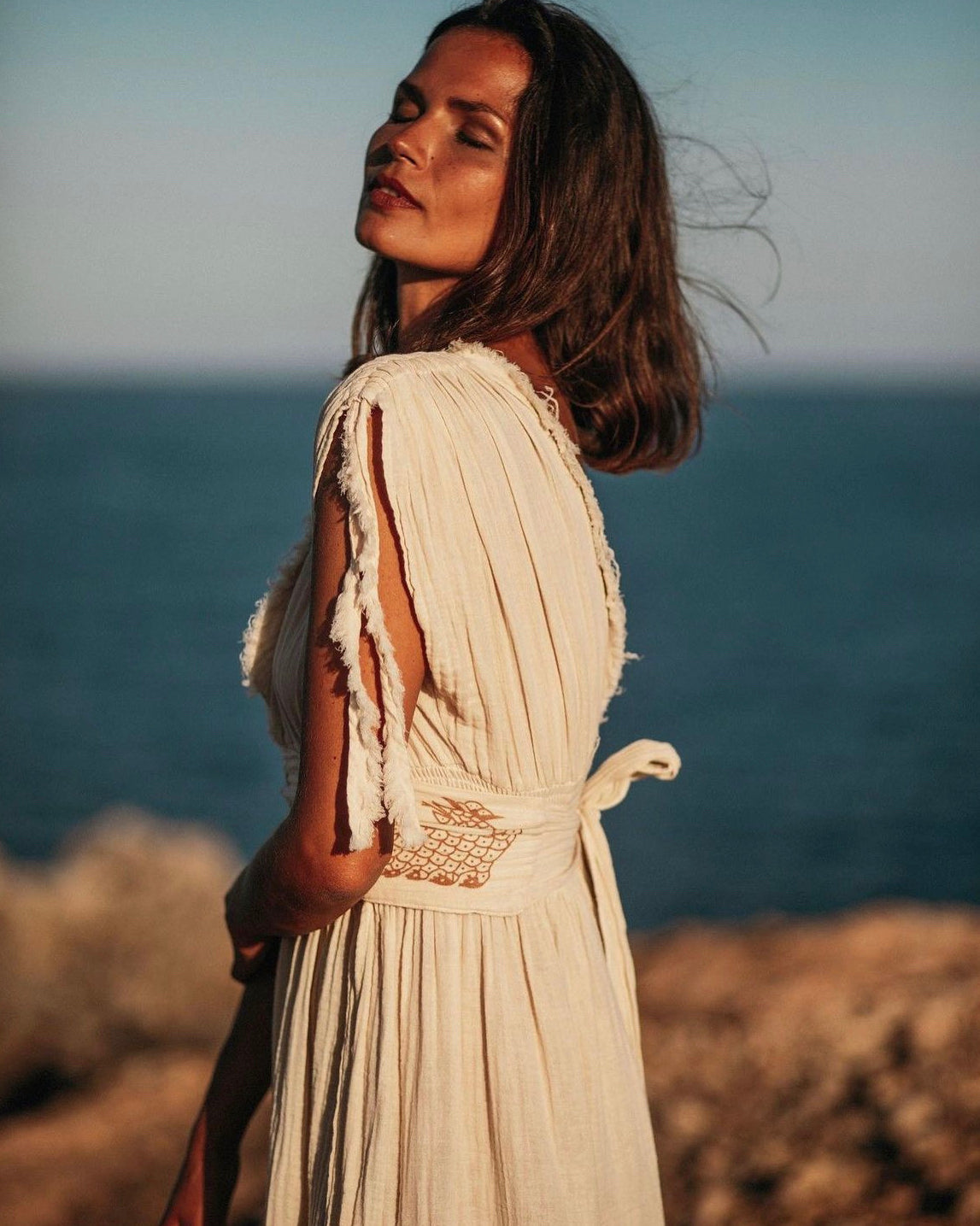 Shahmaran Dress: sleeveless black midi dress with straight neckline and relaxed fit