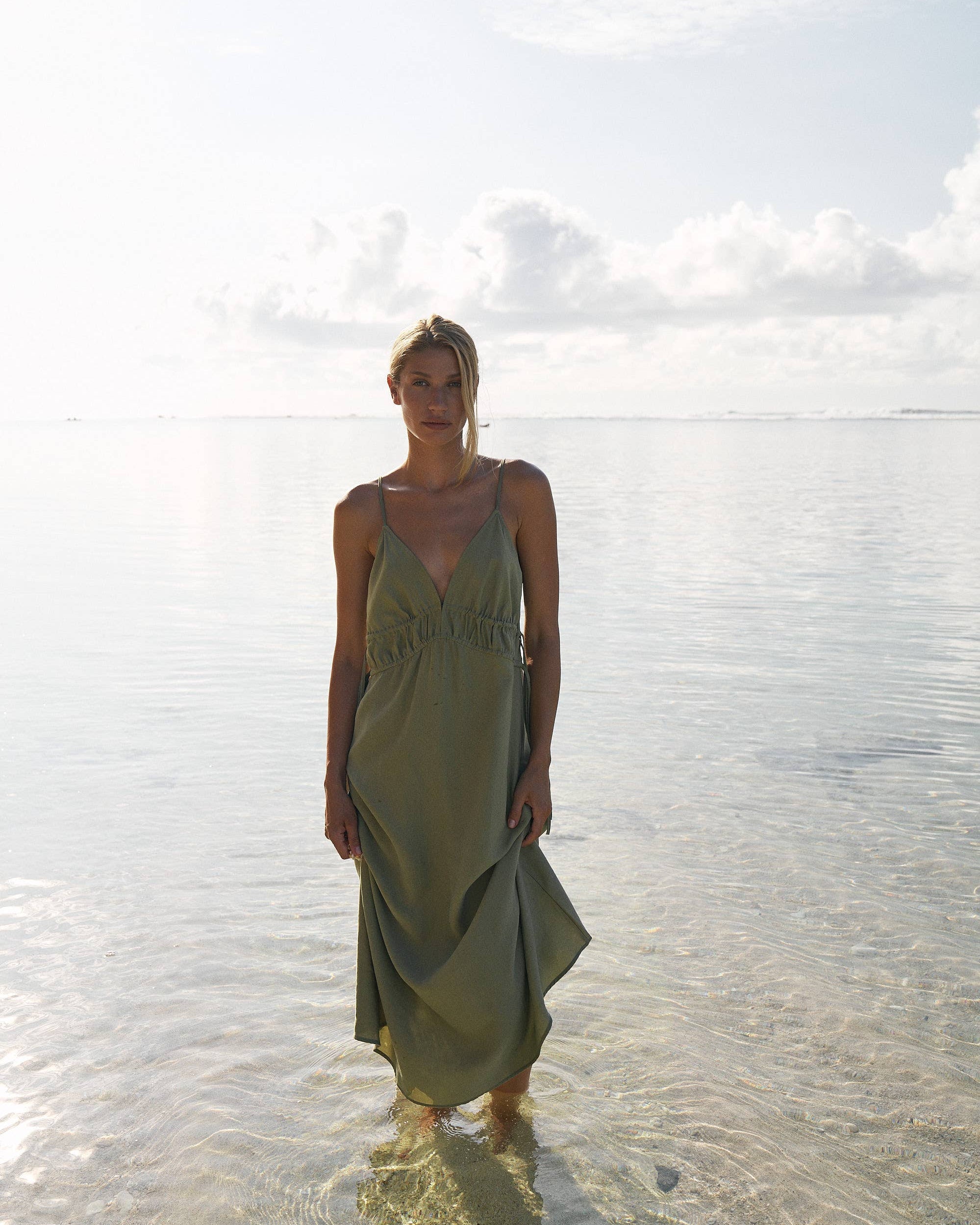 Sofia Ties Maxi Dress: sleeveless beige dress with V-neck, side ties, and flowing maxi length