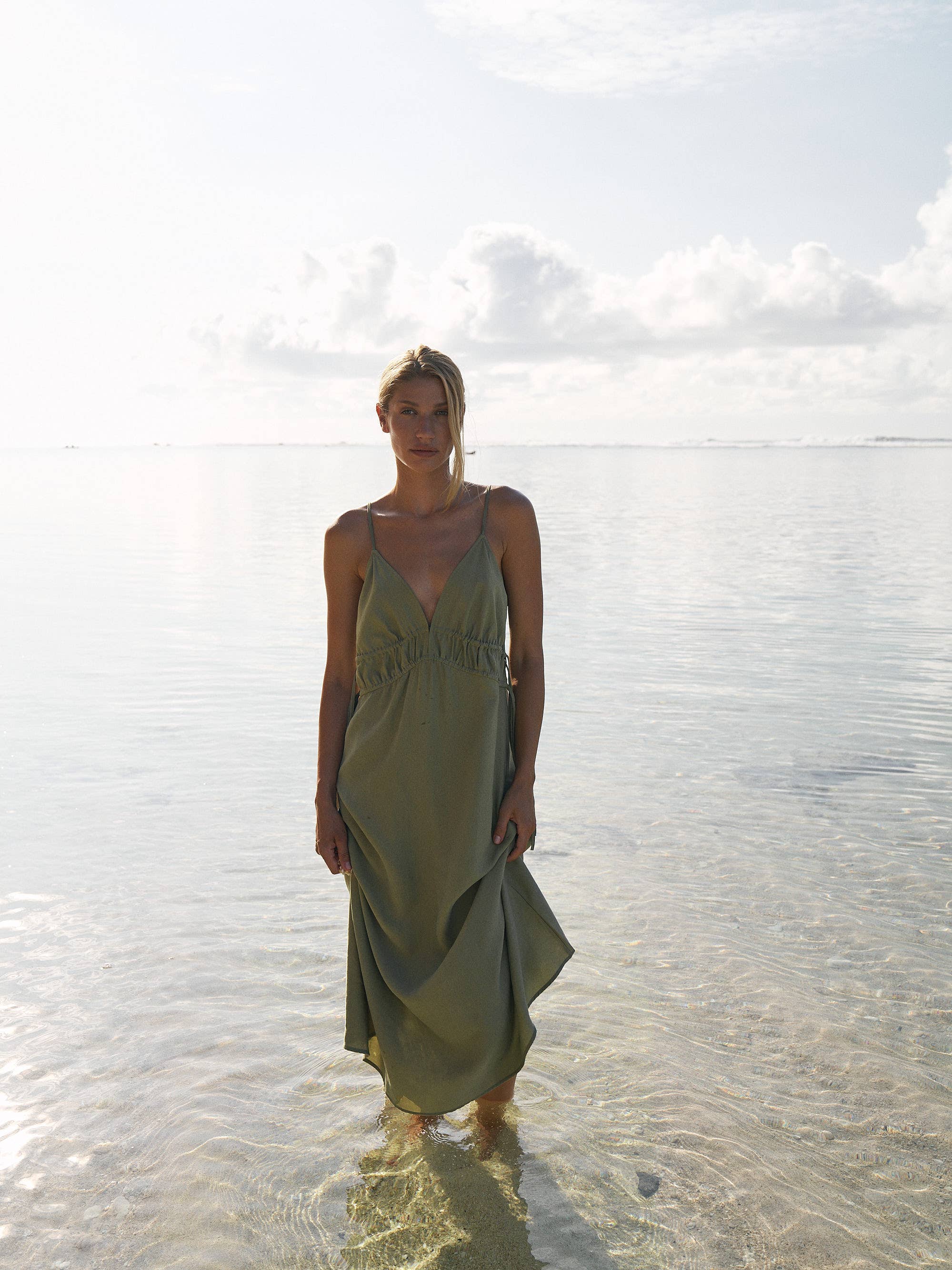 Sofia Ties Maxi Dress: sleeveless beige dress with V-neck, side ties, and flowing maxi length