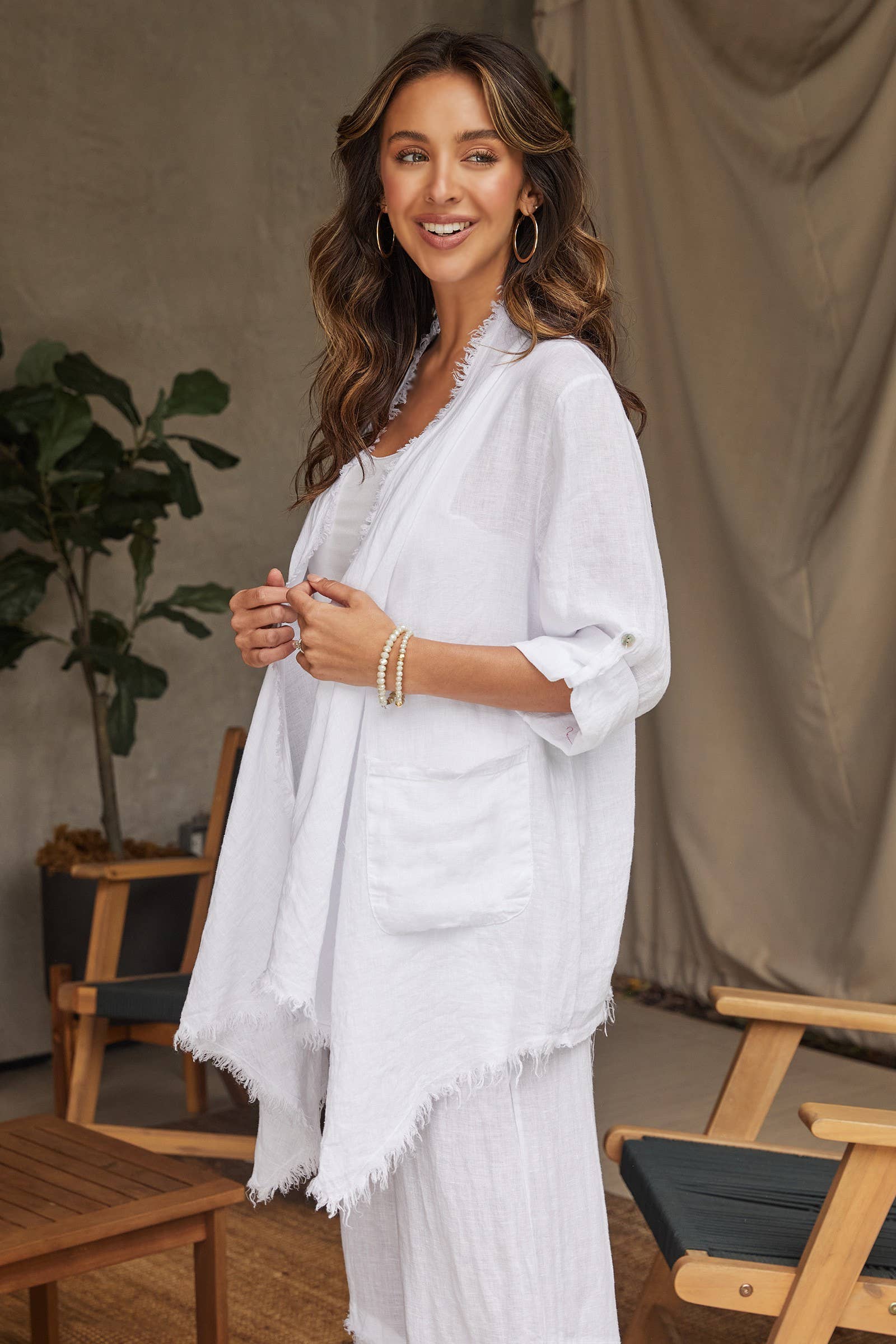 Coastal Drape Linen Cardigan: lightweight beige cardigan with open front, V-neckline, long sleeves, and straight hem
