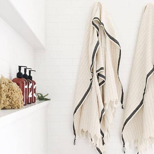 Silvia 100% Cotton Turkish Bath Towel: rectangular white towel with fringed edges and textured weave