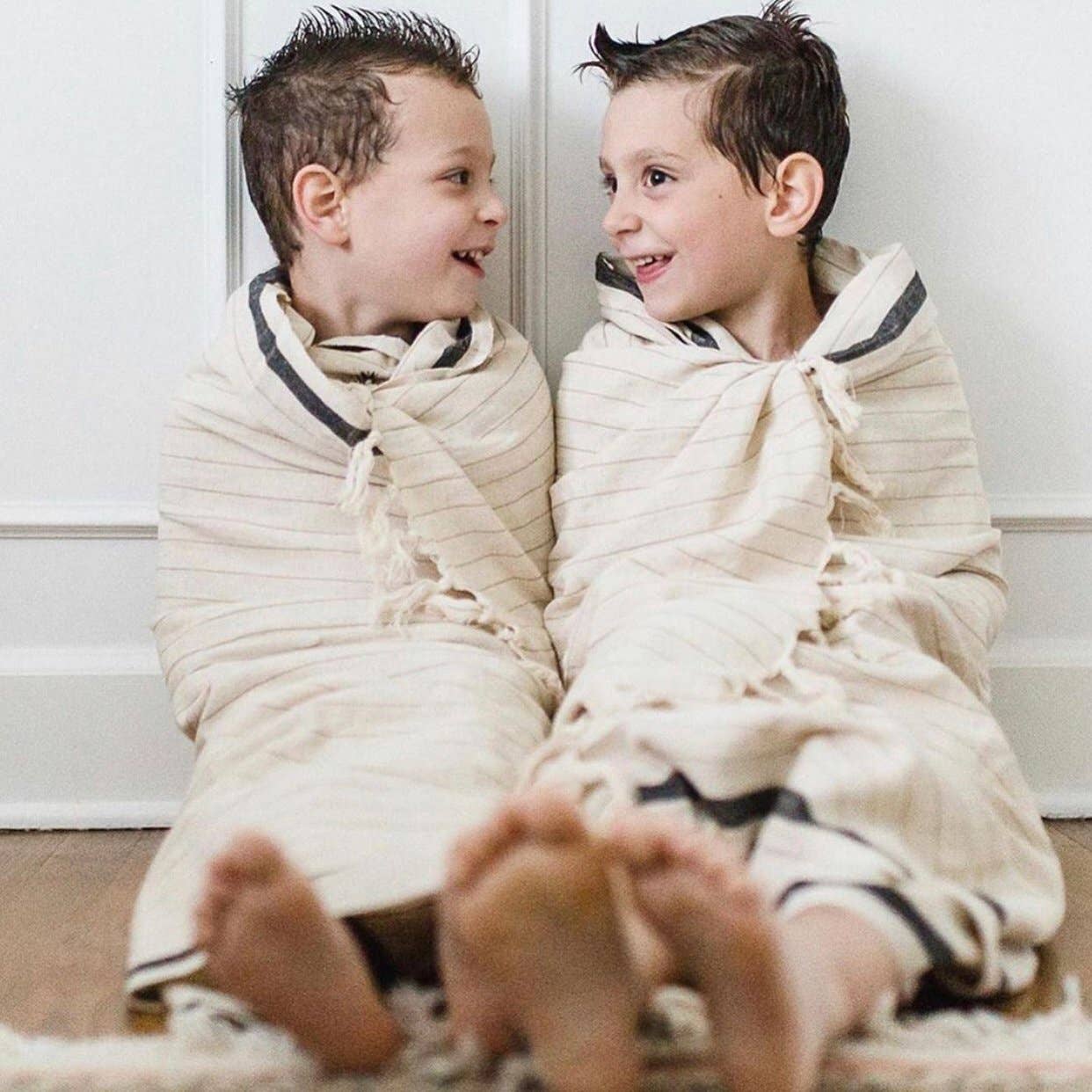 Silvia 100% Cotton Turkish Bath Towel: rectangular white towel with textured stripes and fringe edges