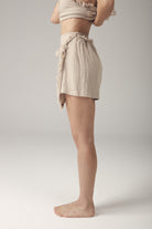 Boho skort: light beige wrap-style shorts with loose fit and mid-thigh length hem