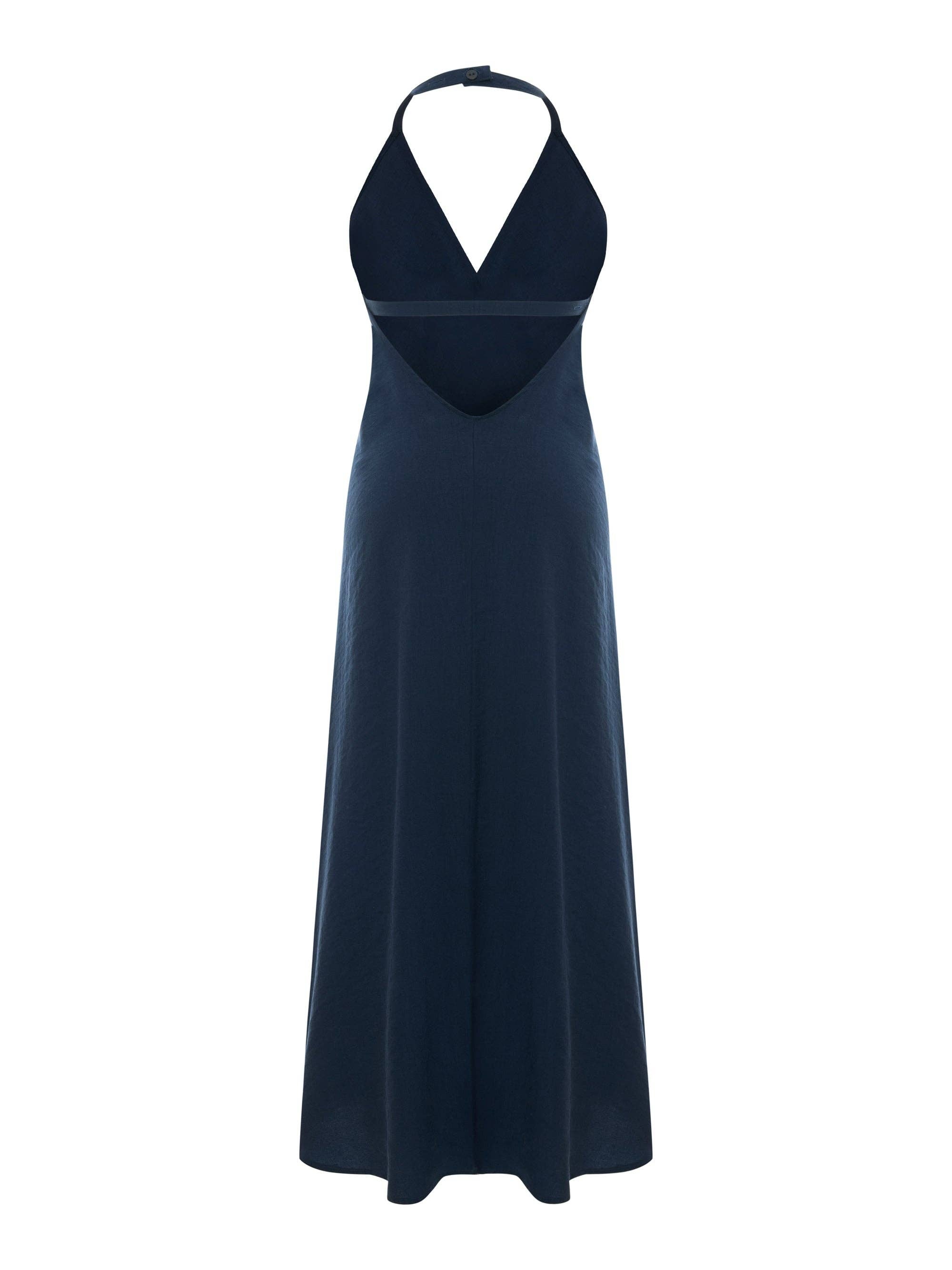 Deep navy halter maxi dress, flat lay, deep V-neckline, center seam bodice, A-line skirt with natural slub texture, single neck button, floor-length hem.