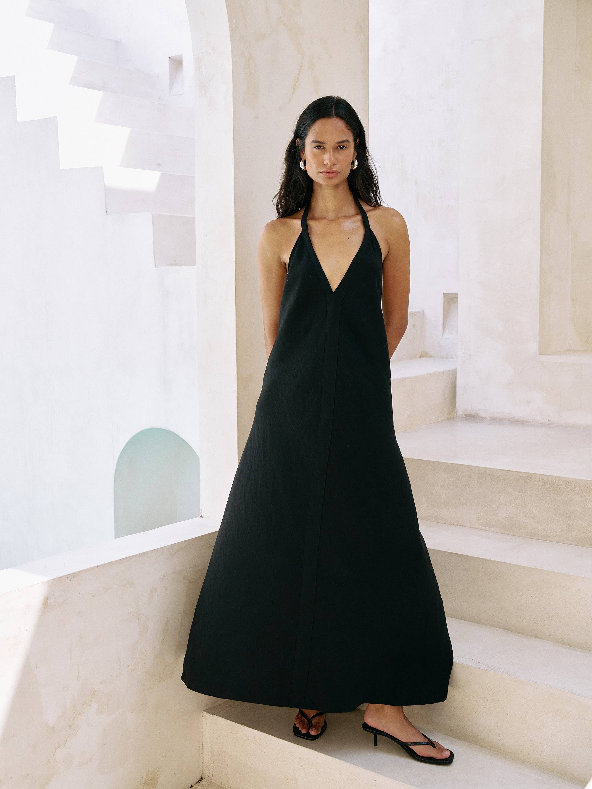 Zoe Maxi Dress: sleeveless black dress with square neckline, fitted bodice, flowing ankle-length hem