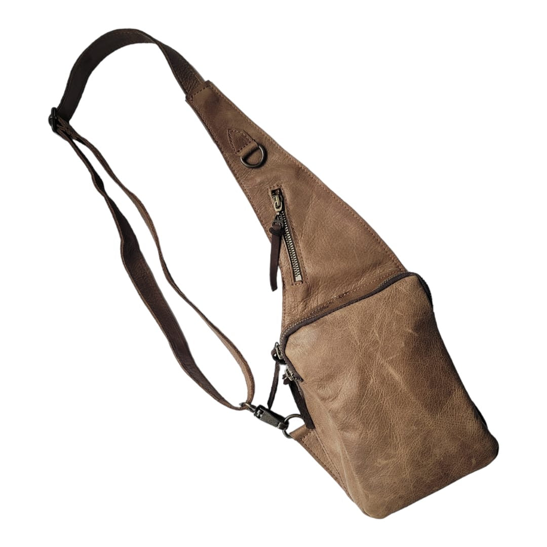 Cross Body bags: black leather curved silhouette with thin adjustable strap and zip closure