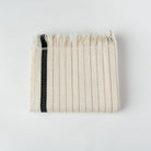 Silvia 100% Cotton Turkish Bath Towel: rectangular, ivory with subtle woven texture and fringed edges