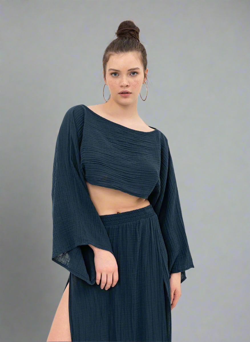 Esme Blouse: white fitted blouse with V-neckline, long sleeves, ruched front, and cropped hem