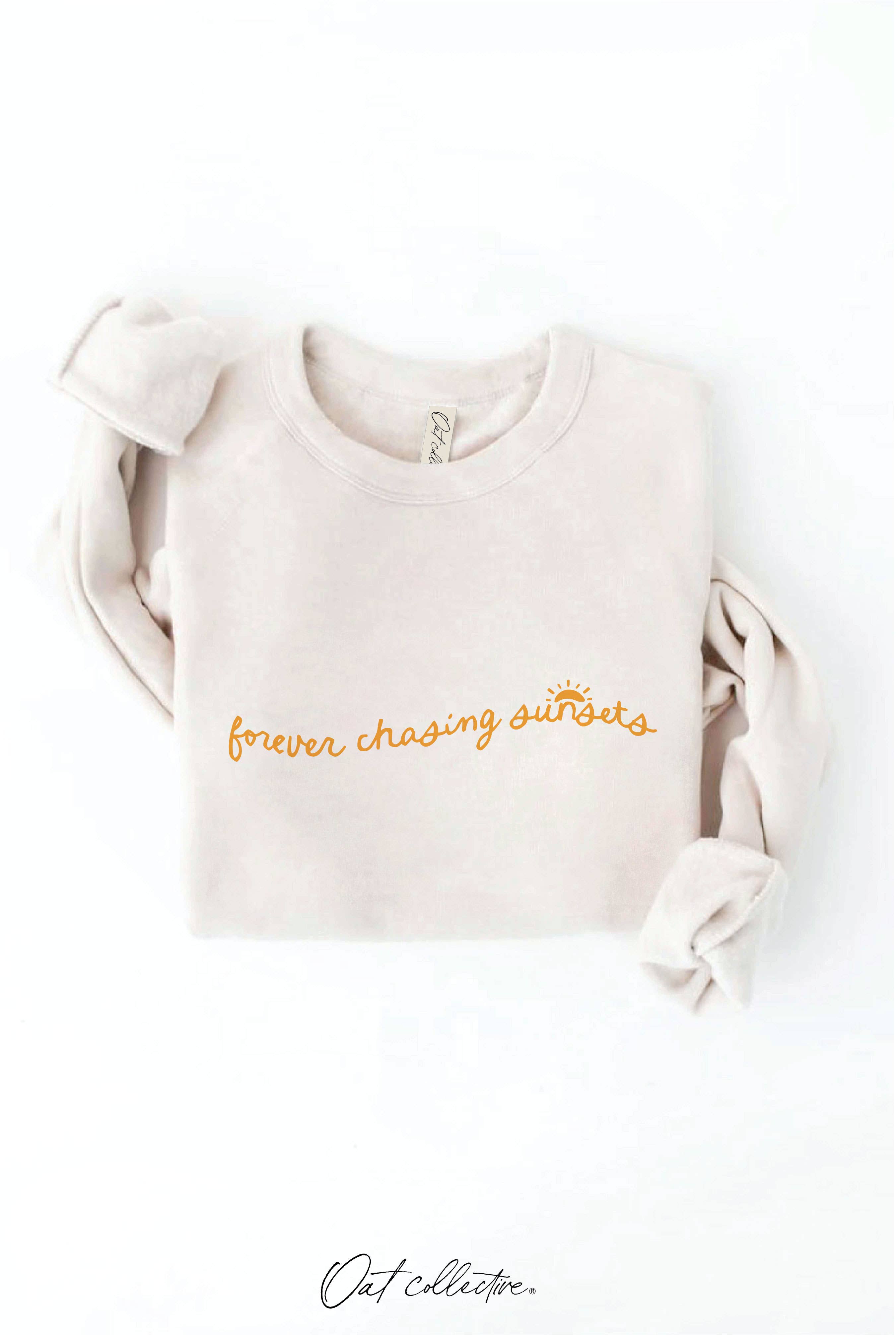 FOREVER CHASING SUNSETS Graphic Sweatshirt: relaxed fit, black, crew neck, long sleeves, ribbed cuffs and hem