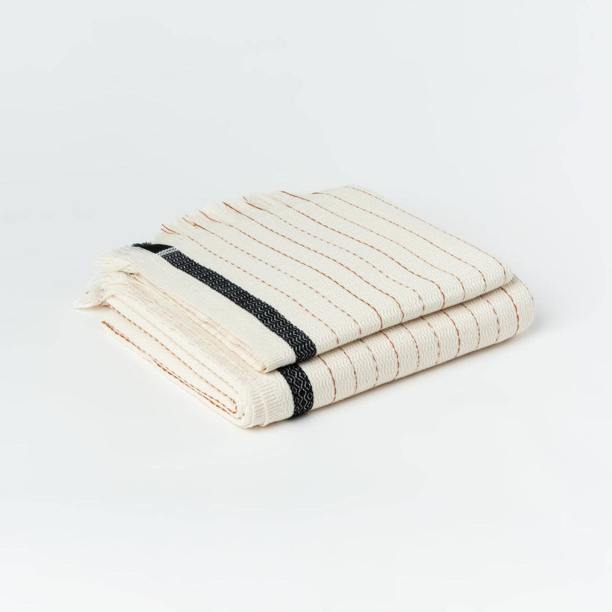 Silvia 100% Cotton Turkish Bath Towel: rectangular beige towel with fringed edges and woven texture
