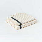 Silvia 100% Cotton Turkish Bath Towel: rectangular beige towel with fringed edges and woven texture