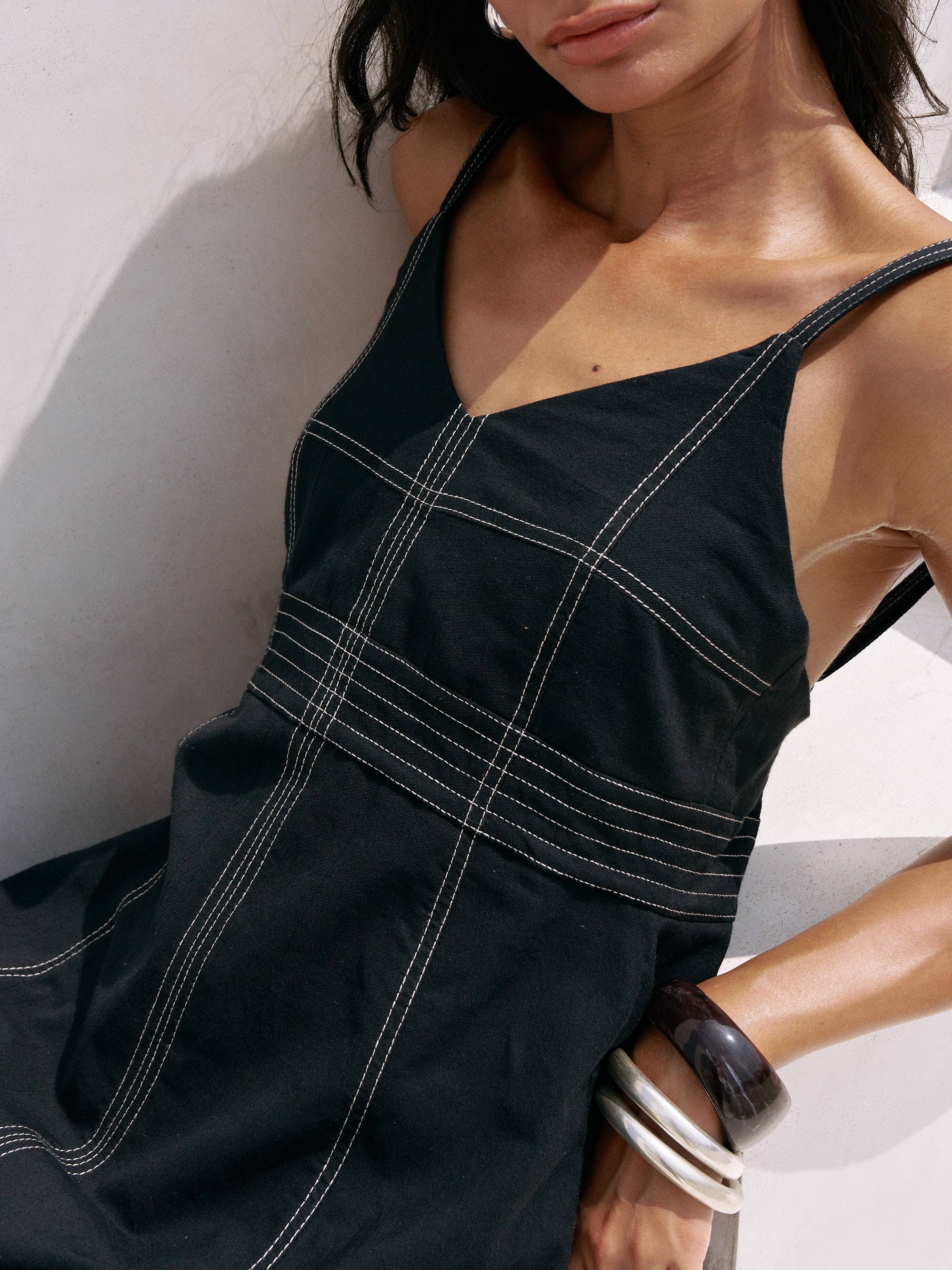 Eva Maxi Dress: sleeveless beige dress with scoop neckline, fitted bodice, and flowing midi skirt