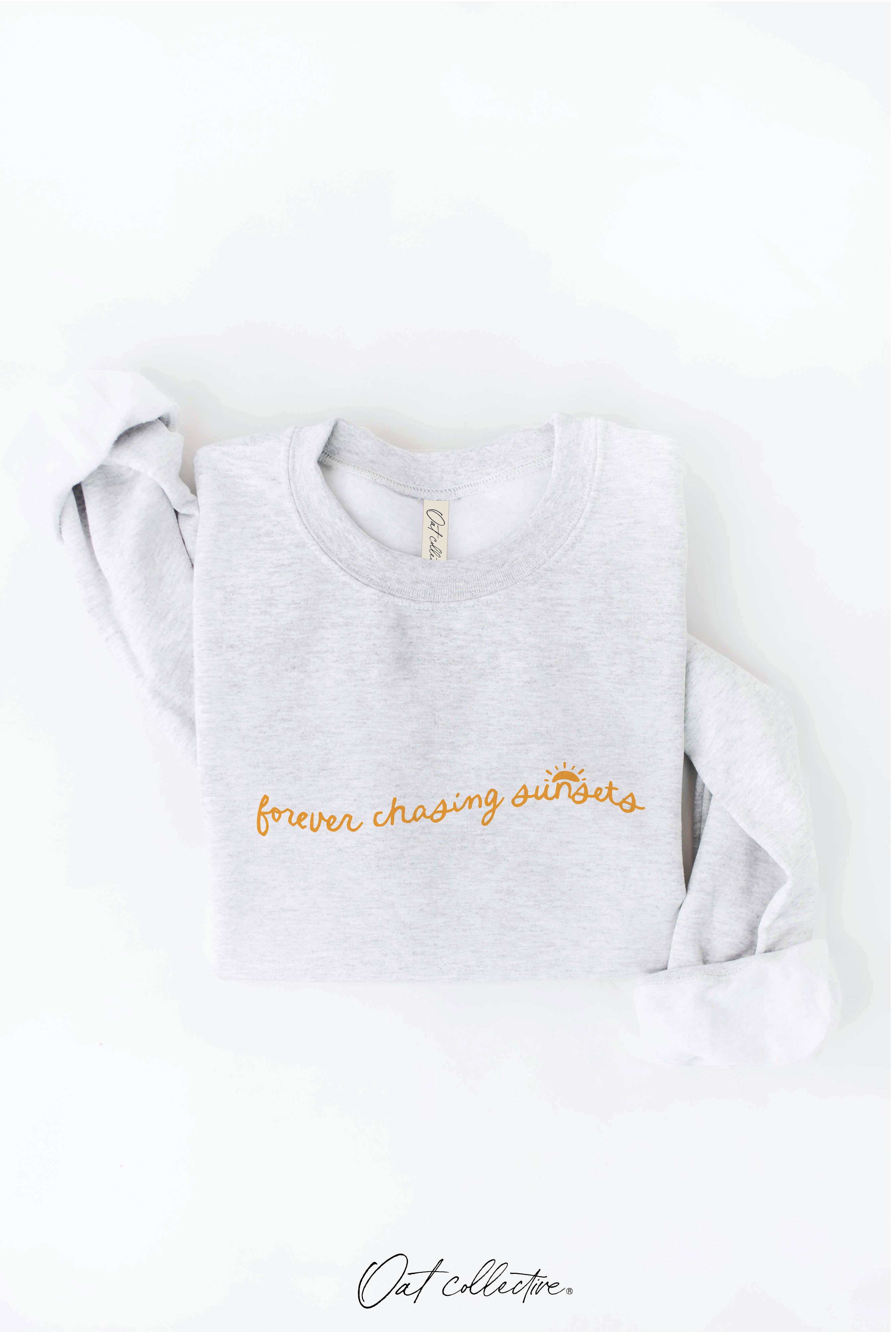 FOREVER CHASING SUNSETS Graphic Sweatshirt: cream oversized fit, crew neckline, long sleeves, ribbed hem and cuffs