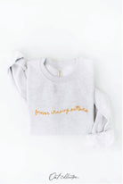 FOREVER CHASING SUNSETS Graphic Sweatshirt: cream oversized fit, crew neckline, long sleeves, ribbed hem and cuffs