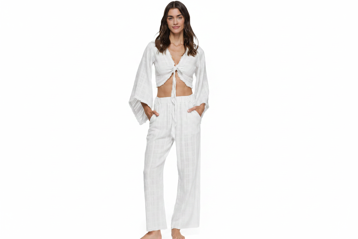 Cropped tie-front cotton top with dramatic wide bell sleeves and raw fringe trim, paired with matching