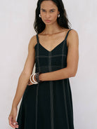 Eva Maxi Dress: sleeveless ivory maxi dress with deep V-neckline and gathered waist