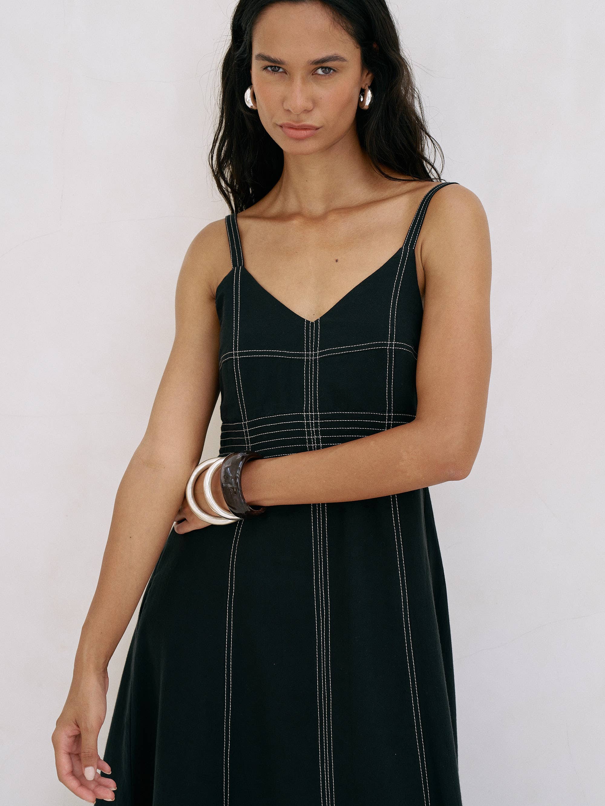 Eva Maxi Dress: sleeveless ivory maxi dress with deep V-neckline and gathered waist