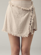 Boho skort: high-waisted beige shorts with asymmetrical front wrap and relaxed fit