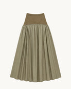 Sage green maxi skirt laid flat, featuring a darker olive suede-texture fitted waistband contrasting a deeply gathered, lightweight flowing skirt panel in muted khaki-green tones.