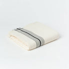 Zebrine 100% Cotton Turkish Hand and Bath Towel: rectangular towel with ivory and dark brown zebra stripe pattern, fringed edges