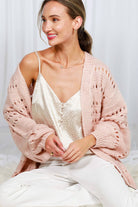 Crochet Balloon Sleeve Cardigan: light beige, fitted silhouette, cropped length, round neckline, voluminous balloon sleeves, ribbed hem