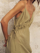 Sofia Ties Maxi Dress: sleeves, V-neckline, tie waist, flowing ankle-length hem, soft beige fabric
