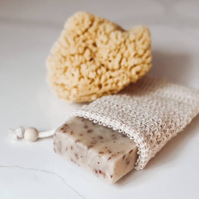 Large Natural Bath Sea Sponge 4.5” - 5” (Wool): round, irregular shape with natural beige color and porous texture