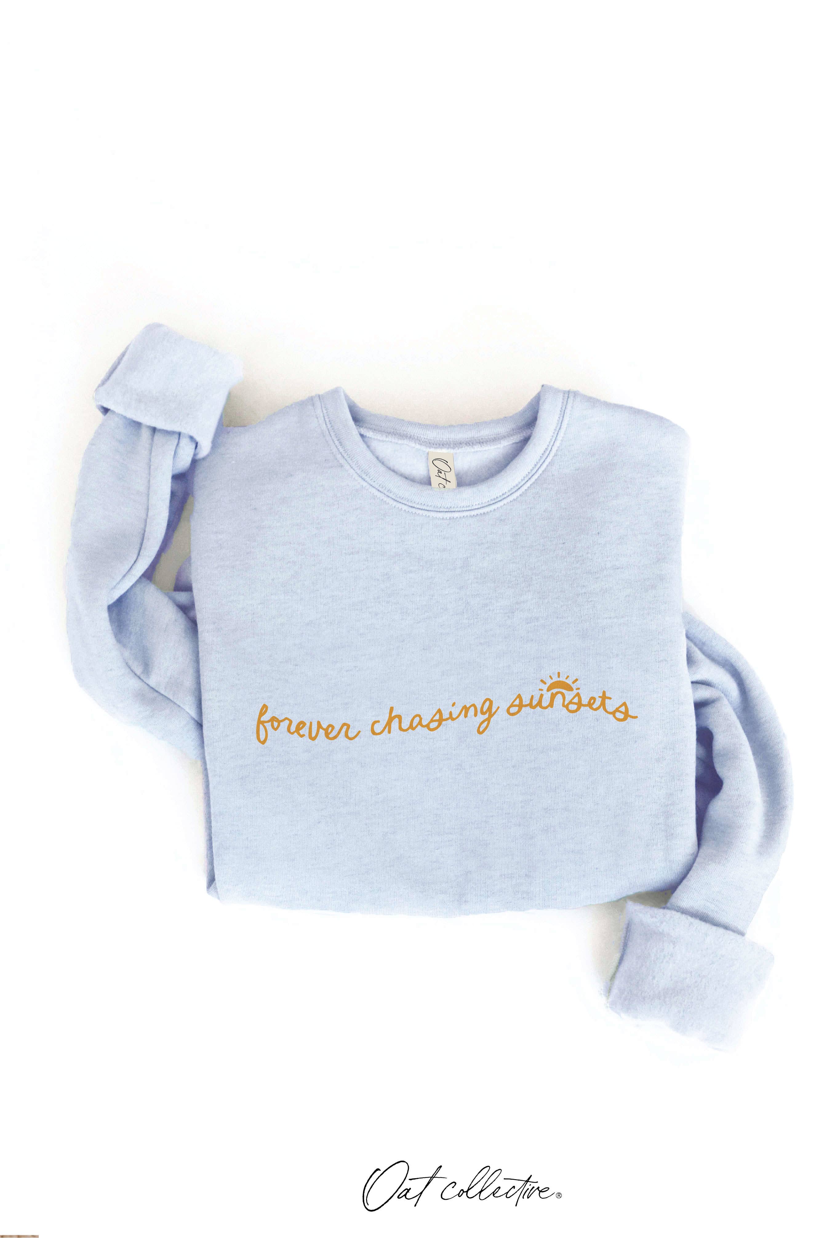 FOREVER CHASING SUNSETS Graphic Sweatshirt: cream crewneck with relaxed fit, long sleeves, and ribbed hem and cuffs